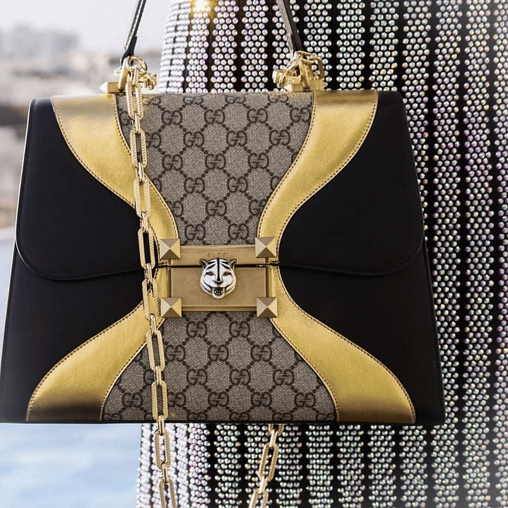 CARTERA DORADA GUCCI 5