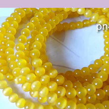 Ojo de gato liso color amarillo de 4 mm, tira de 95 piedra
