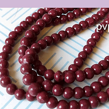 Perla de vidrio burdeo 6 mm tira de 72 piedras aprox