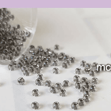 Mostacilla calibrada gris tornasol 11/0 , 20 grs.