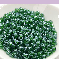 Mostacillón color verde cristal, bolsa de 50 grs. (6/0)