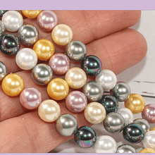 Perla Shell 8 mm, en tonos verde, gris, rosado y amarillo, tira de 48 perlas aprox