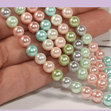 Perla Shell 6 mm, en tonos rosados, verdes y celestes, tira de 64 perlas aprox