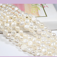Perla de rio ovalada irregular,  6 a 7 mm, tira de 62 perlas aprox.