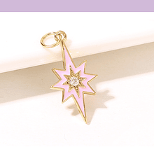 Colgante estrella del sur, baño de oro, con zircón, y esmalte rosado, 21 x 11 mm, por unidad
