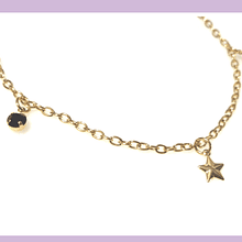 Pulsera baño de oro, con dijes de cristal negro y estrella, 21 cm, de largo, por unidad.