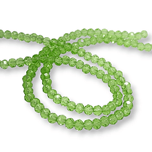 Cristal chino facetado de 4 mm color verde claro  transparente, tira de 128 unidades aprox