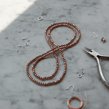 Cristal facetado 1.5 mm en color cobrizo metálico, 195 cristales aprox