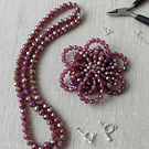 Cristal 10 x 8 mm, tonos rojo tornasol con brillos metálico, set de 20 unidades