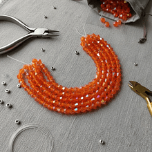 Cristal tupi 6 mm color naranjo tornasol de 45 cristales aprox