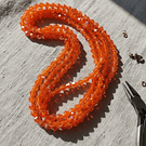 Cristal tupi 6 mm color naranjo tornasol de 45 cristales aprox