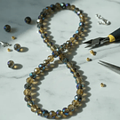 Cristal facetado de 6 mm, color verde t café tornasol, tira de 85 cristales aprox.