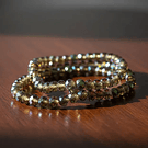 Cristal facetado de 6 mm, color verde t café tornasol, tira de 85 cristales aprox.