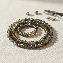 Cristal facetado de 6 mm, color verde t café tornasol, tira de 85 cristales aprox.