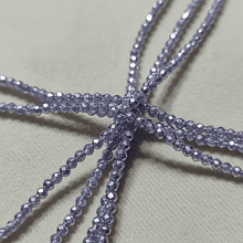 Cristal facetado 1.5 mm en color lila metalizado, 195 cristales aprox