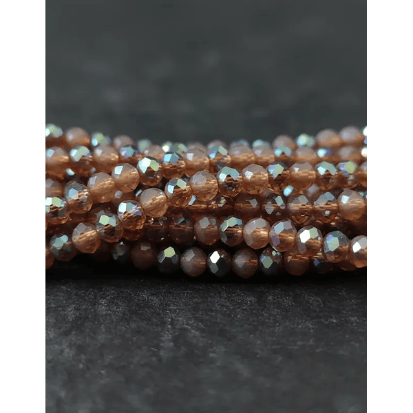 Cristal de 4 mm, color café con brillos plateados tira de 128 cristales aprox.-