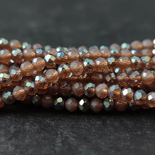 Cristal de 4 mm, color café con brillos plateados tira de 128 cristales aprox.-