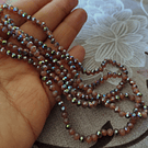 Cristal de 4 mm, color café con brillos plateados tira de 128 cristales aprox.-