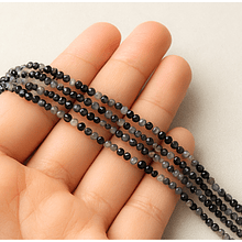 Piedras cuarzo turmalinado facetado de  2 mm, tira de 180 piedras aprox.