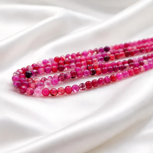 Agata facetada de 4 mm, en tonos fucsias y rosa agua de 95 piedras APROx