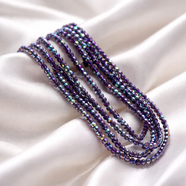 Cristal facetado 1.5 mm en color morado con brillos tornasol, 195 cristales aprox