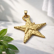 Colgante estrella baño de oro opaco, 75 x 77 mm, por unidad