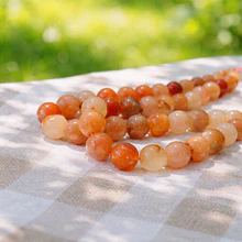 Agata de 10 mm, en tonos naranjos y crema, tira de 37 piedras aprox.