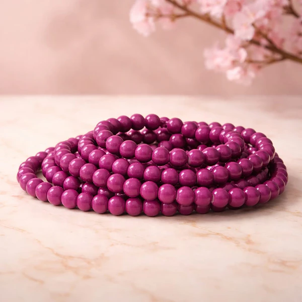 Perla de vidrio en color burdeo de 8 mm, tira de 53 unidades aprox.