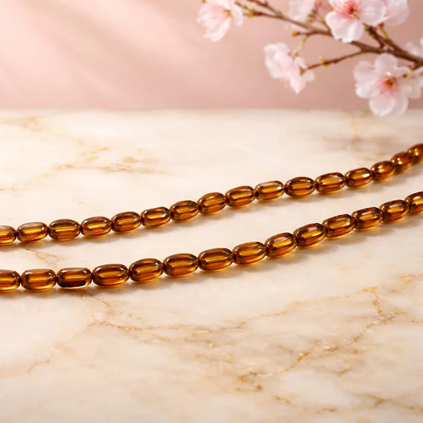 Cristal cafè con aplicación, 7 x 4 mm, tira de 50 cristales aprox