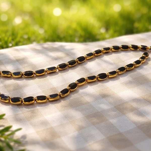 Cristal negro con aplicación, 7 x 4 mm, tira de 50 cristales aprox