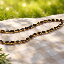 Cristal negro con aplicación, 7 x 4 mm, tira de 50 cristales aprox