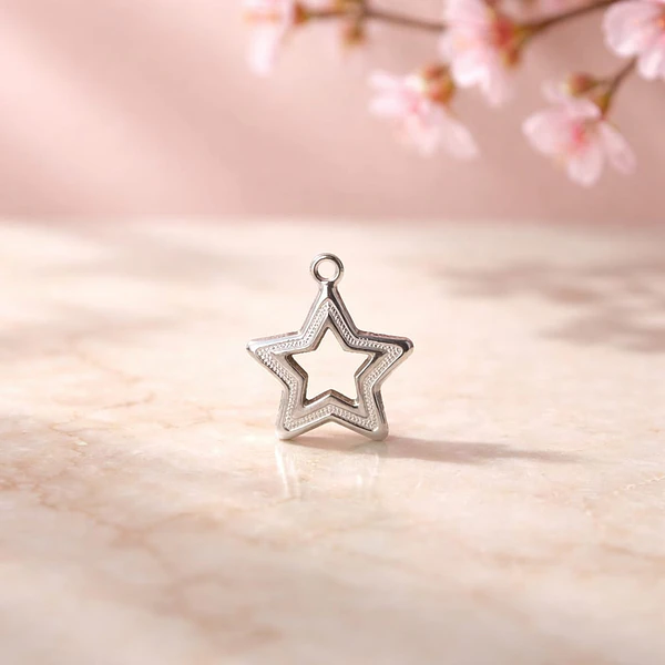 Dije estrella baño de plata, 17 x 10 mm, por unidad