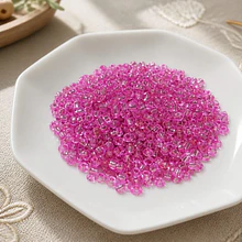 Mostacillón color fucsia cristal bolsa de 40 grs (6/0)