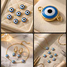 Conector ojo turco doble conexión, con borde baño de oro, 18 x 11 mm, por unidad