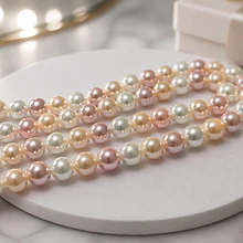 Perla Shell 8 mm, en tonos rosados y crema, tira de 45 perlas aprox
