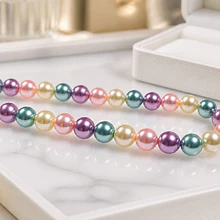 Perla Shell 8 mm, en tonos multicolor tira de 45 perlas aprox
