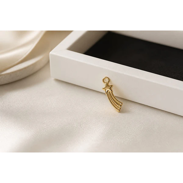 Dije estrella fugaz, baño de oro, 19 x 5 mm, por unidad