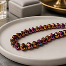 Cristal 10 x 8 mm, tonos rojizo metalico tornasol set de 20 unidades
