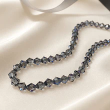 Cristal tupi 6 mm gris tornasol, tira de 45 cristales aprox