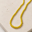 Cristal facetado color amarillo 4 mm, tira de 125 cristales aprox
