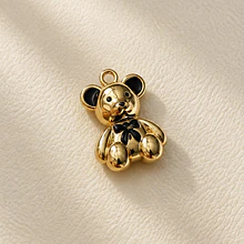 Colgante Oso, baño de oro, con esmaltado negro, 17 x 12 mm. por unidad