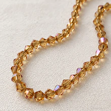 Cristal tupi 4 mm, color café claro tornasol, tira de 100 cristales aprox