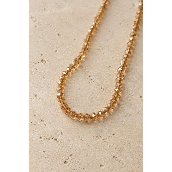 Cristal facetado 1.5 mm en color café claro tornasol, 195 cristales aprox
