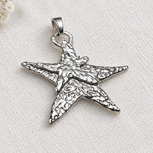 Colgante estrella baño de plata, 75 x 77 mm, por unidad