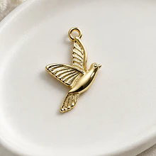 Dije pájaro baño de oro, 22 x 14 mm, por unidad