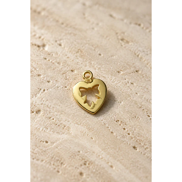 Dije baño de oro corazón con figura de cinta, 18 k, color oro claro, 