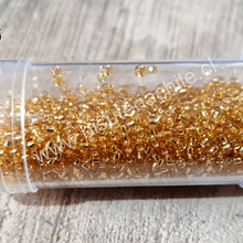 Mostacilla calibrada, dorado cristal, 20 grs    (CAJA 5)