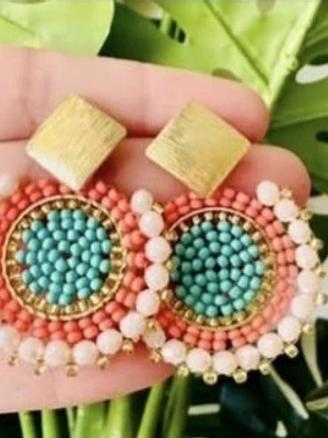 Aros en alambrismo bañado en oro y cristales centro naranjo