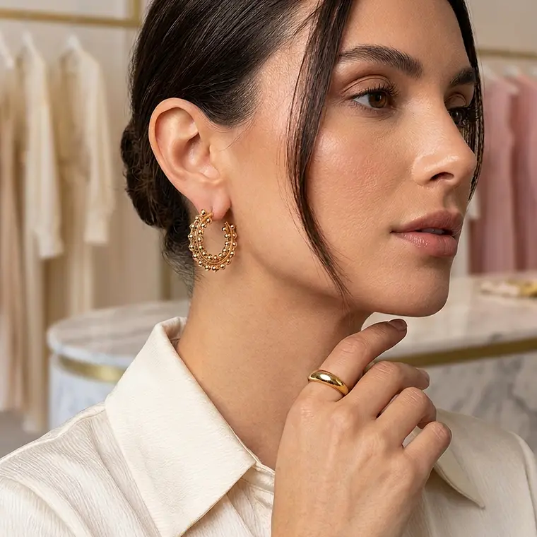 Aros estilo caracol baño de oro 1