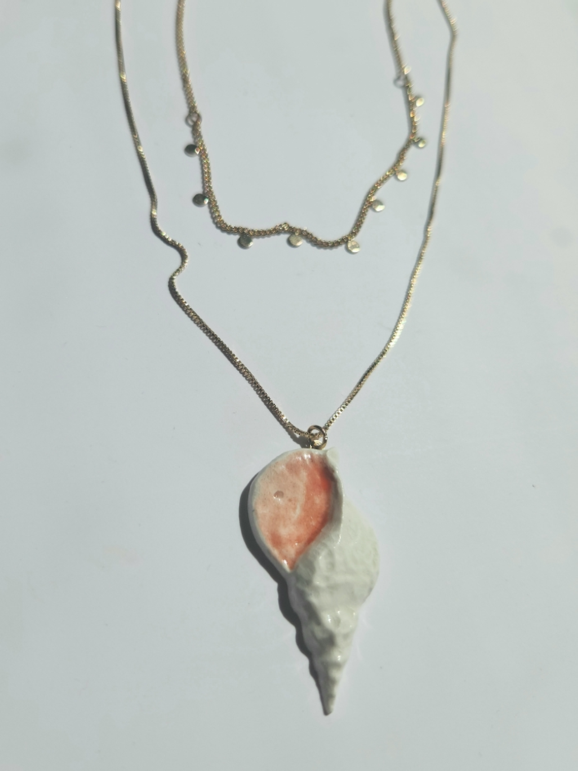 Colgante caracola doble cadena 1